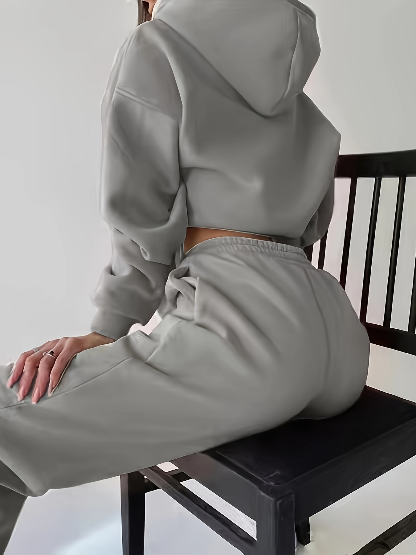 Model walking in the comfortable knit set